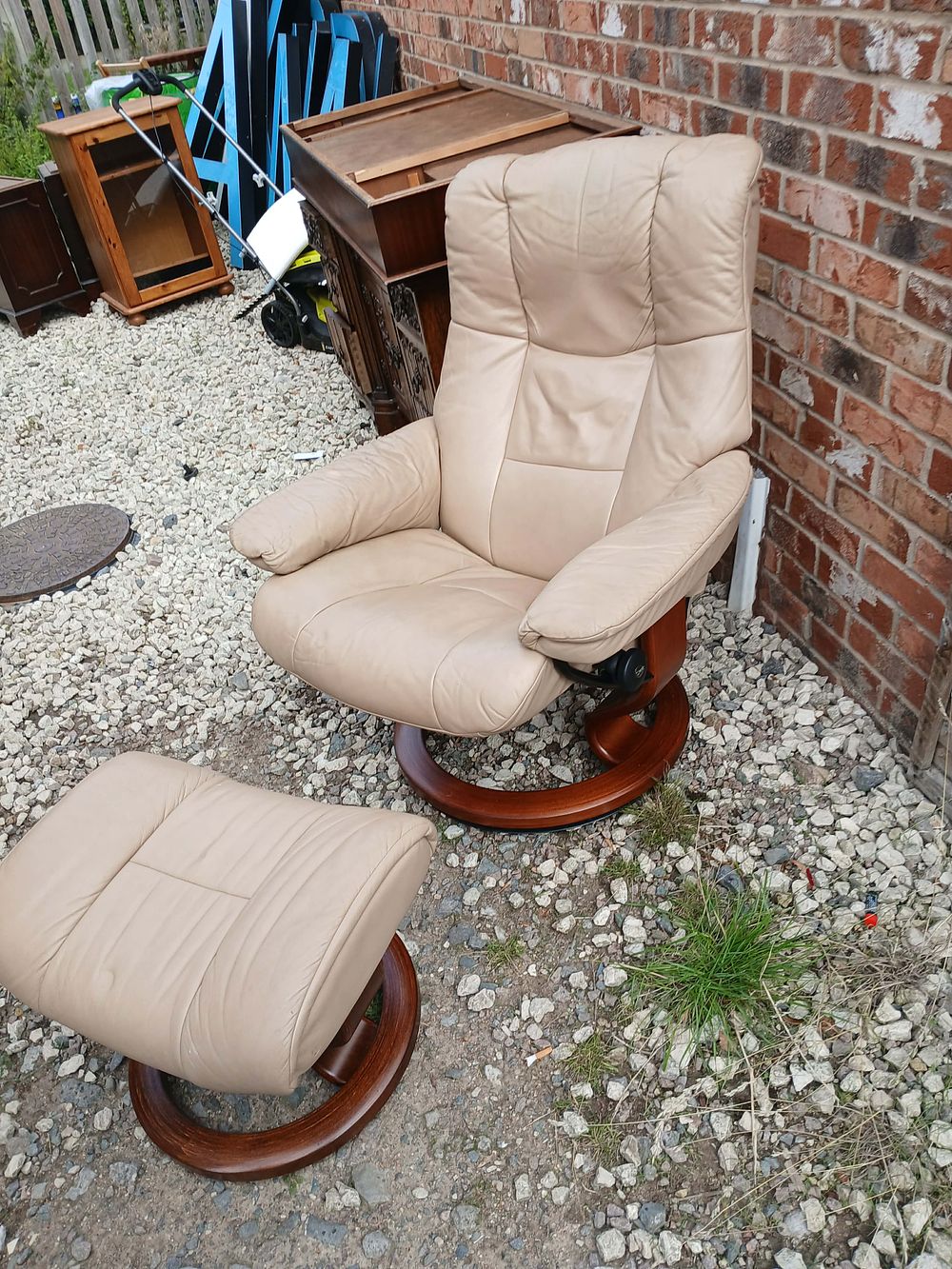 Lot 965: Contemporary Leather Reclining Armchair and Matching Footstool