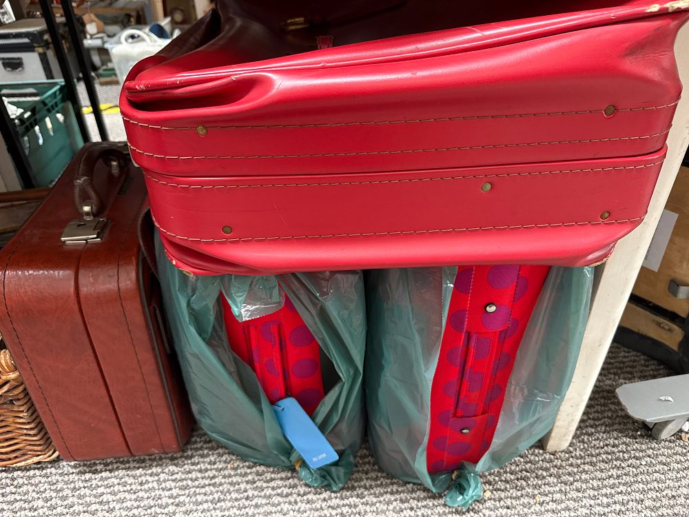Lot 939: Four Vintage and Modern Red and Brown Synthetic and Fabric Suitcases