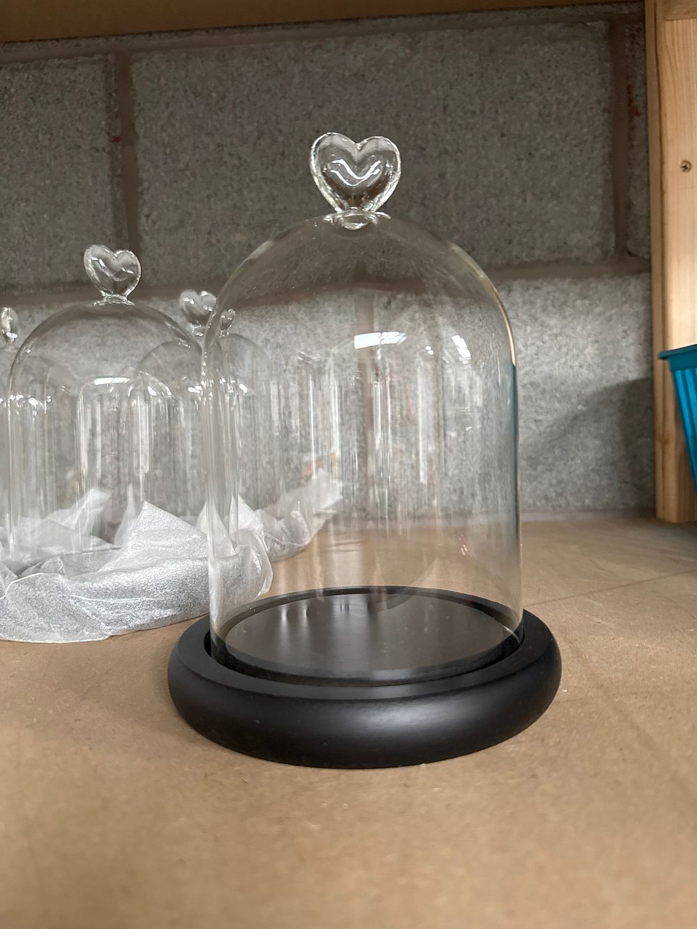 Lot 940: A Collection of Ten Glass Heart Finial Cloches with Matte Black Bases, 8"