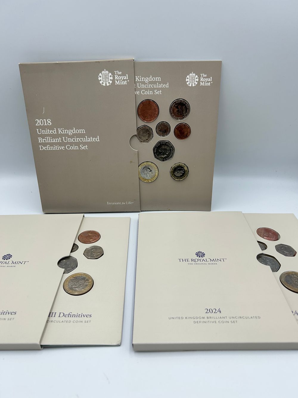 Lot 75: The Royal Mint Brilliant Uncirculated Definitive Coin Sets, 2018 and 2024