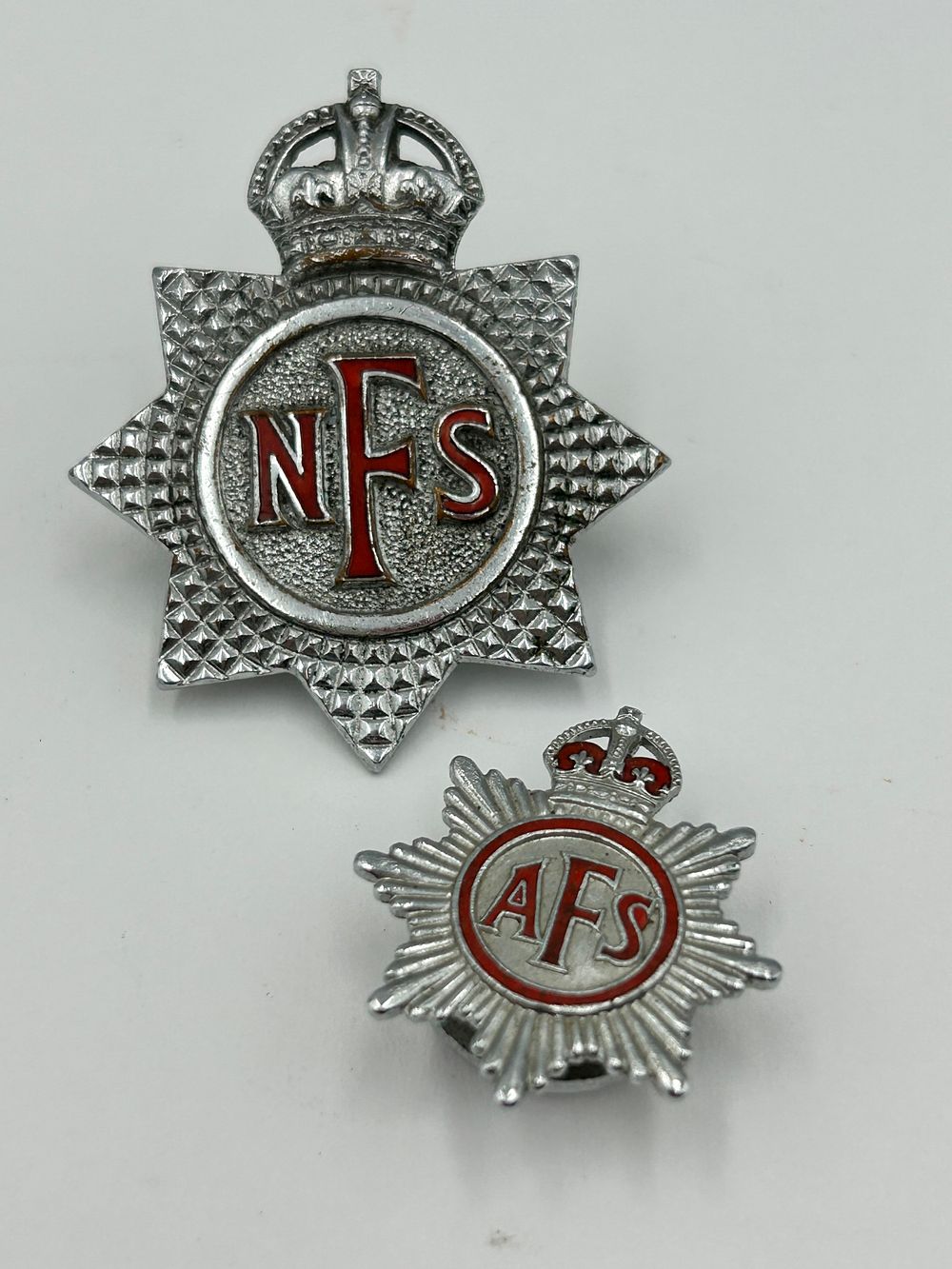 Lot 84: Two White Metal and Enamel Fire Service Badges, Mid 20th Century