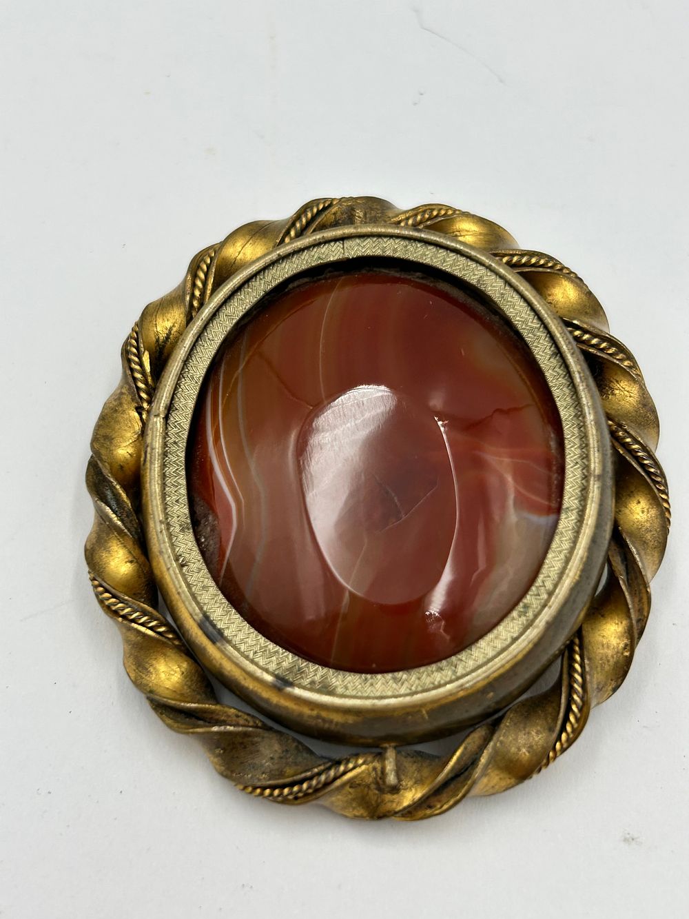 Lot 100: Victorian Gilt-Metal Effect Swivel Banded Agate/ Mourning Brooch