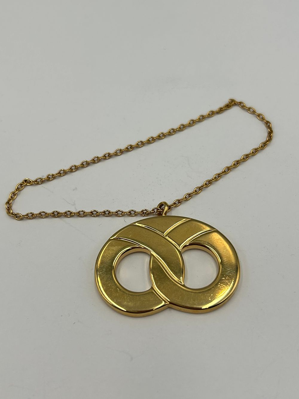 Lot 105: Georg Jensen Gilt-Metal Effect Logo Charm or Key Fob, Denmark