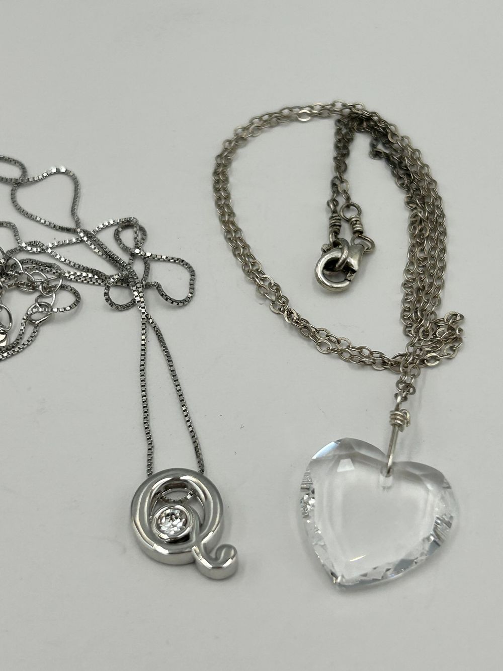 Lot 108: Two White Metal Pendant Necklaces, Including Cryslove S925 Sterling Silver