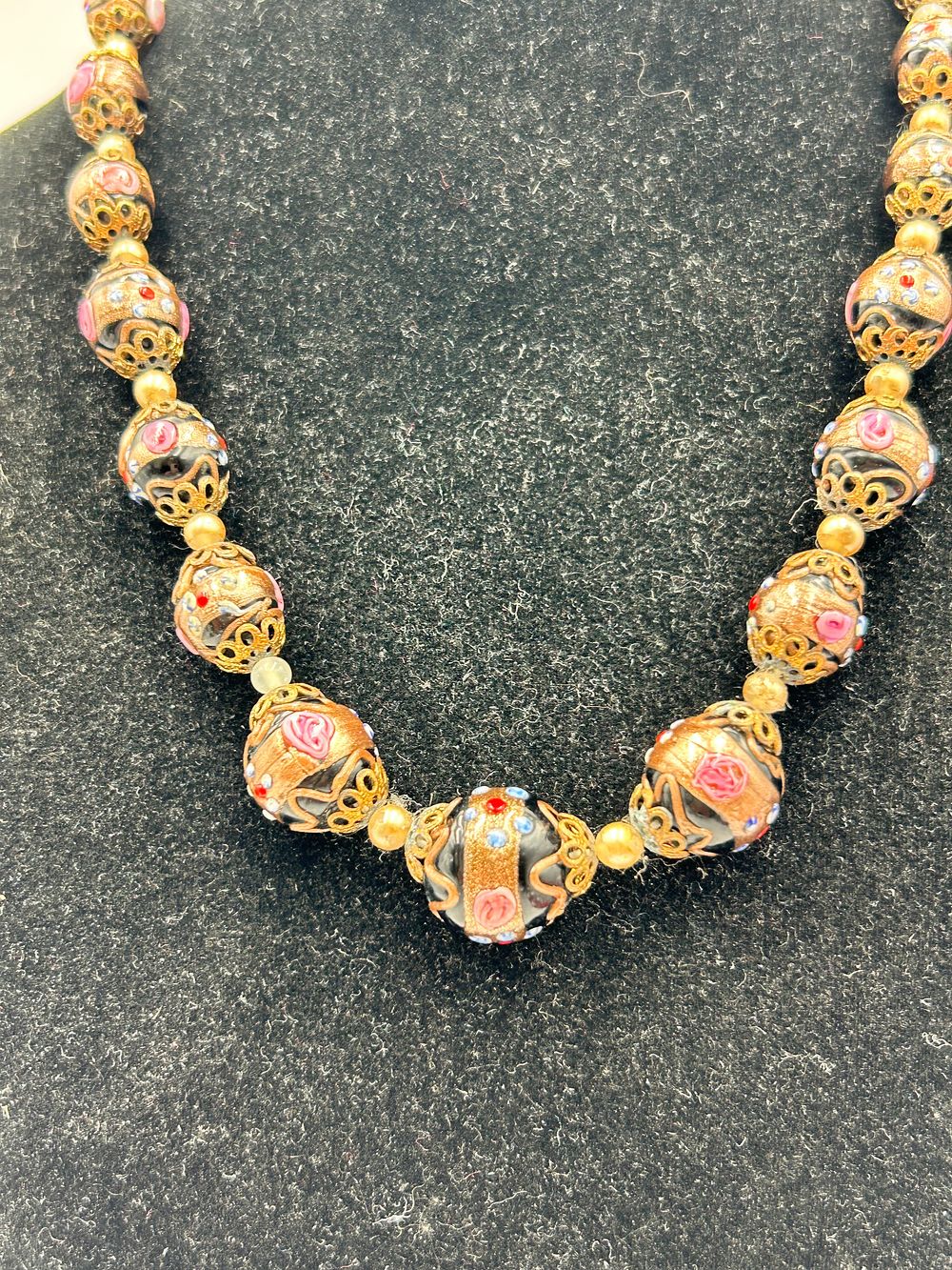 Lot 113: Vintage Venetian? Glass Wedding Cake Bead Necklace with Gilt-Metal Effect Filigree Caps