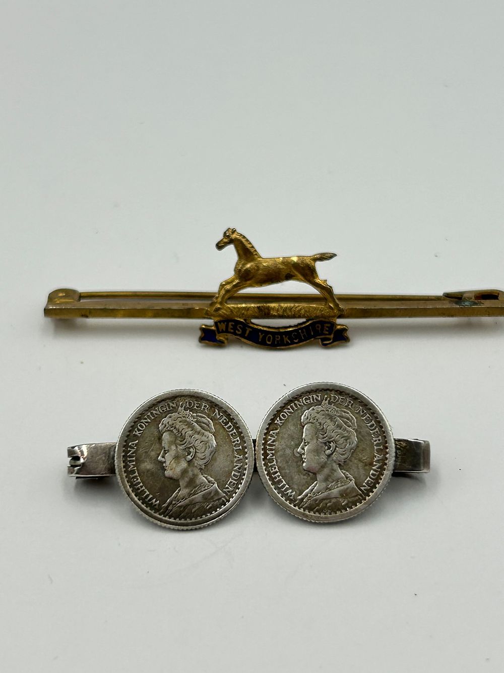 Lot 136: A West Yorkshire Regiment Gilt-Metal Effect Sweetheart Brooch and a Queen Wilhelmina Silver Coin Brooch, Birmingham, 1945?