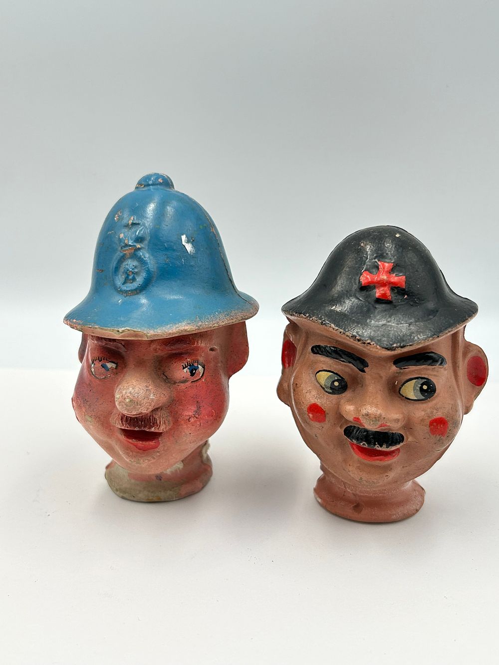 Lot 138: A Pair of Composition? Puppet Heads of a Nurse and Policeman