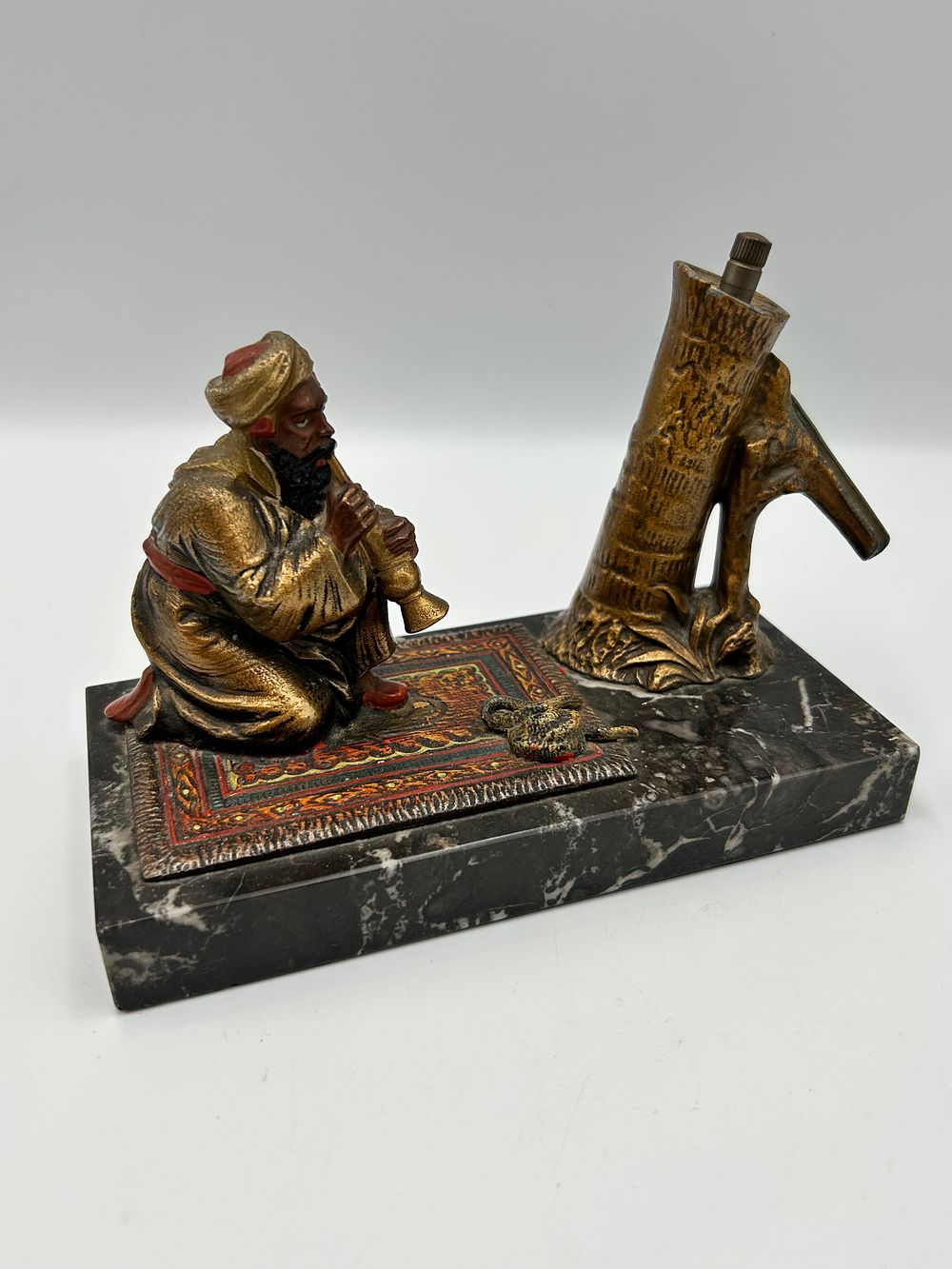 Lot 152: Orientalist Polychrome Bronzed Figure of a Snake Charmer on Marble Base