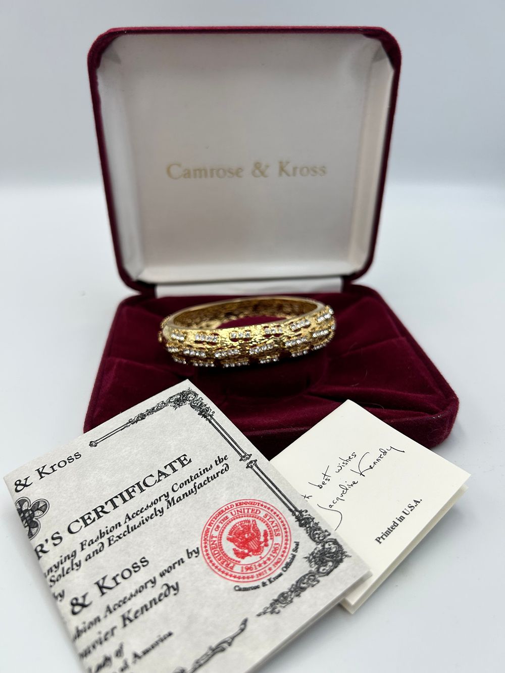 Lot 178: Camrose & Kross Jacqueline Kennedy Collection Gilt Metal Effect Bangle