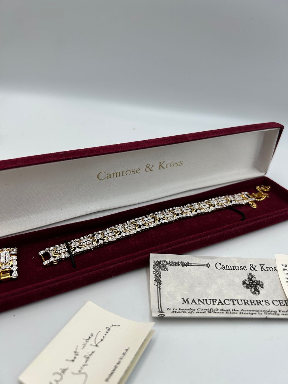 Lot 195: Camrose & Kross Jacqueline Kennedy Collection Gilt Metal Effect and White Metal Link Bracelet