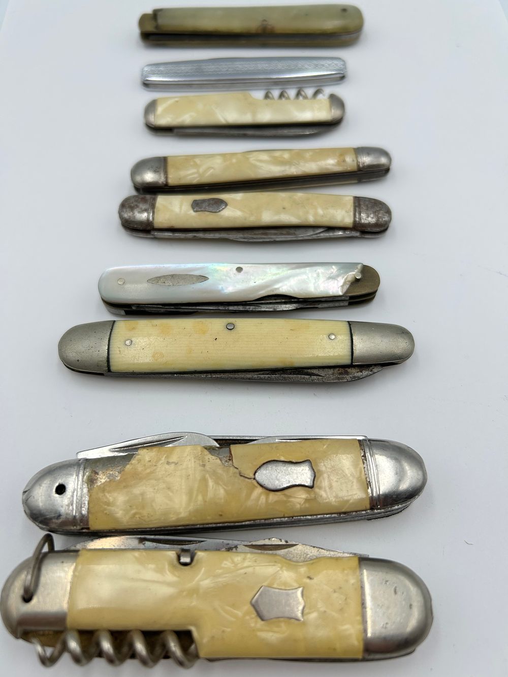Lot 235: A Collection of Vintage Mother-of-Pearl? and Celluloid? Pocket Knives, Sheffield?