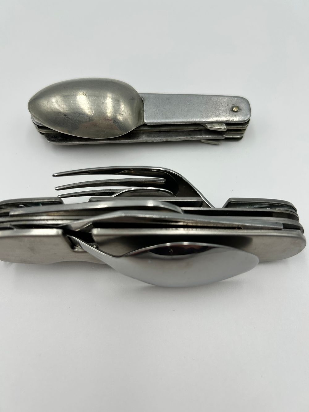 Lot 242: Two Vintage Stainless Steel Multi-Tool Camping Utensil Sets