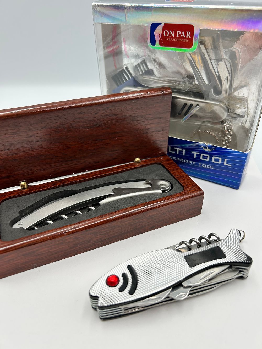 Lot 243: On Par White Metal Golf Accessory Multi-Tool and Beverage Tools