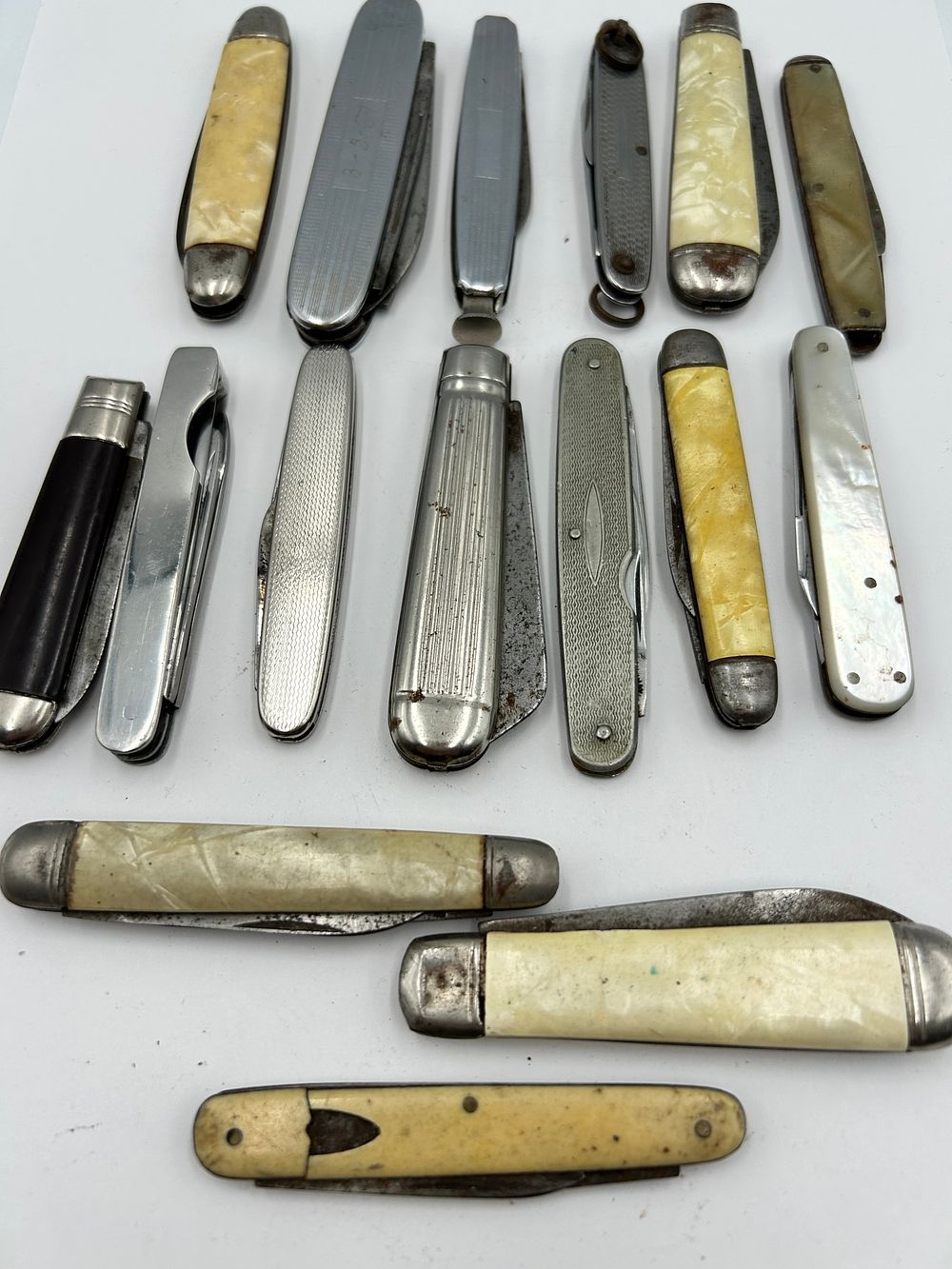 Lot 247: A Collection of Vintage Mother of Pearl? and Celluloid Folding Pocket Knives