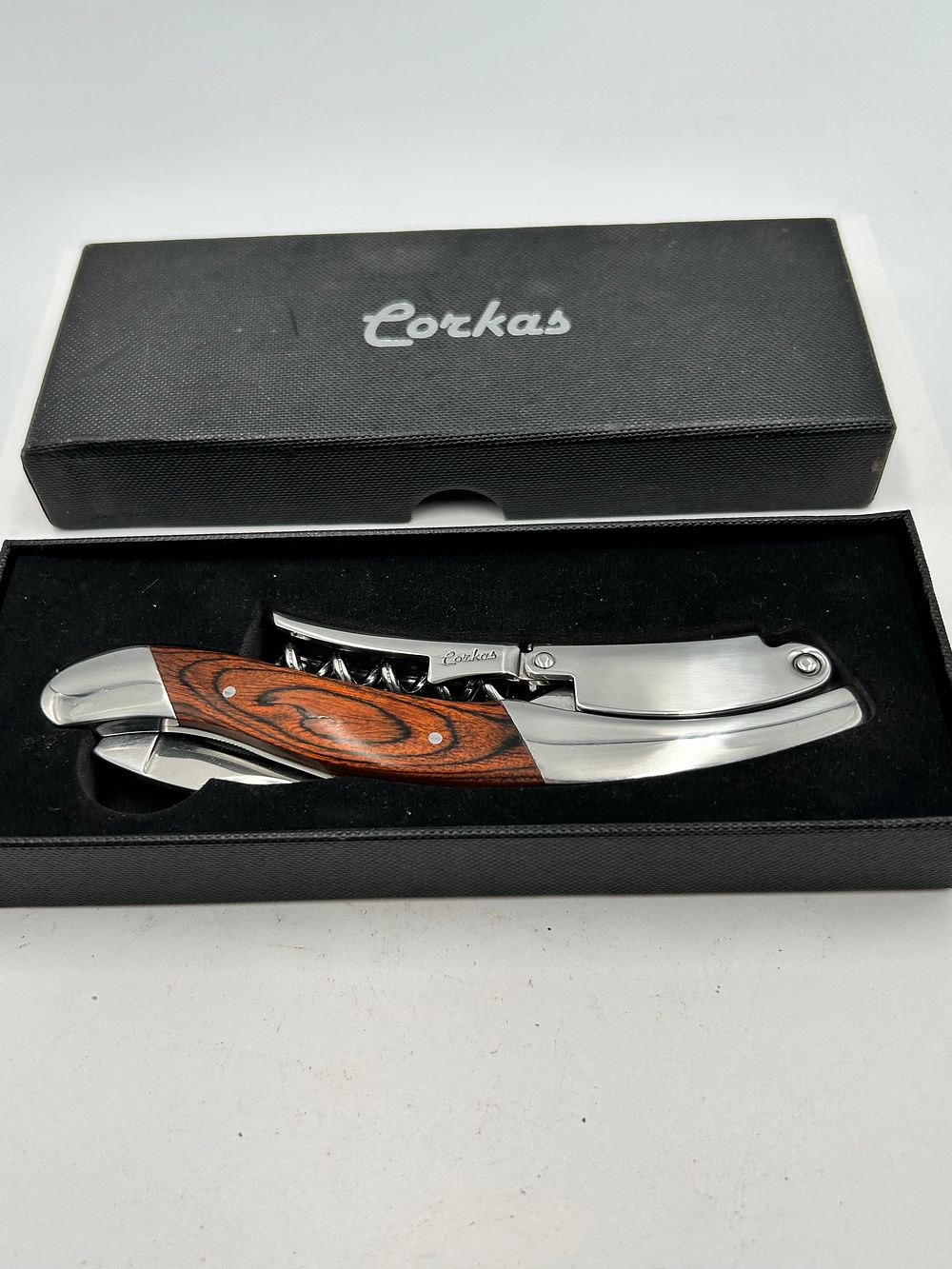 Lot 249: Corkas Polished Stainless Steel and Rosewood? Waiter's Friend Corkscrew