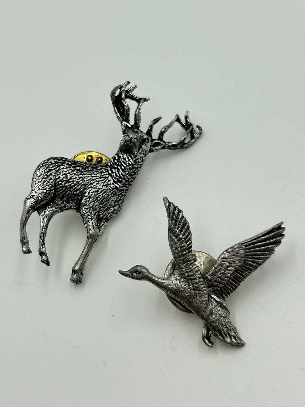 Lot 253: Two Pewter Wildlife Motif Lapel Pins