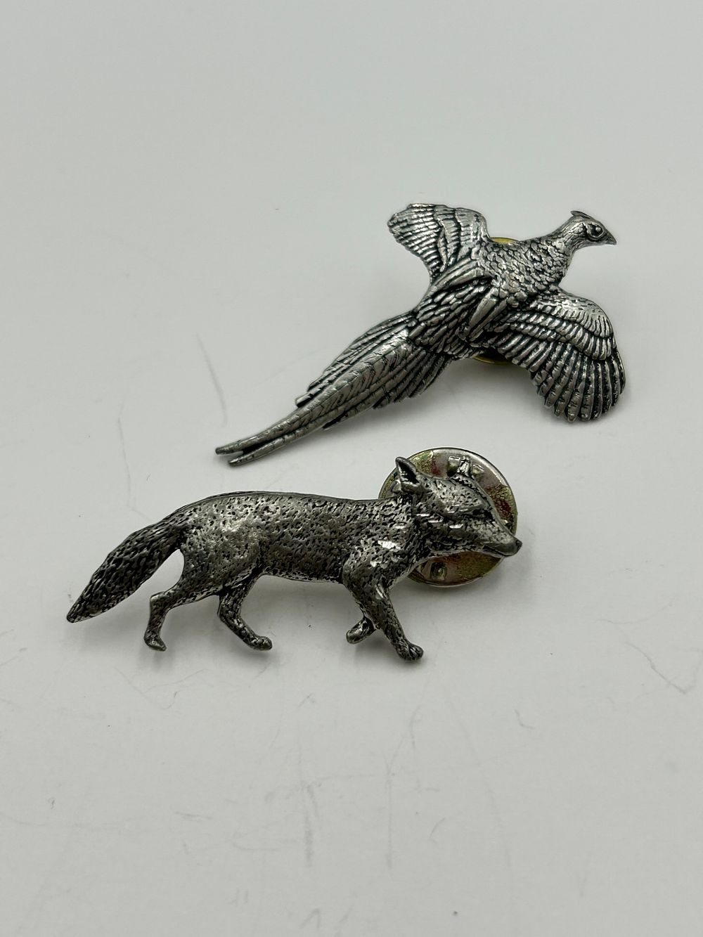 Lot 255: Two A.R. Fowler? White Metal Wildlife Lapel Pins