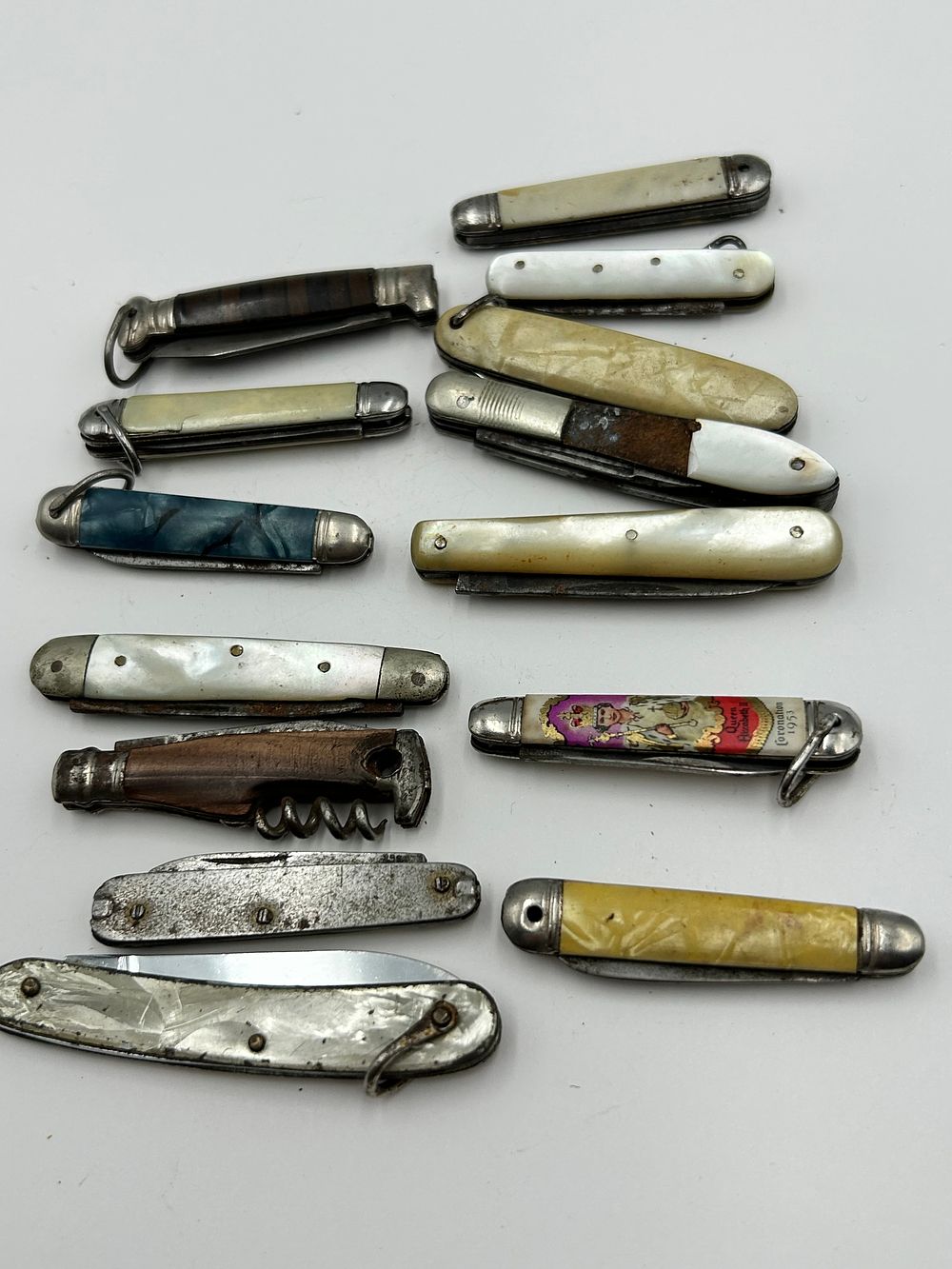 Lot 257: A Collection of Vintage Mother-of-Pearl? and Celluloid? Pocket Knives, 20th Century