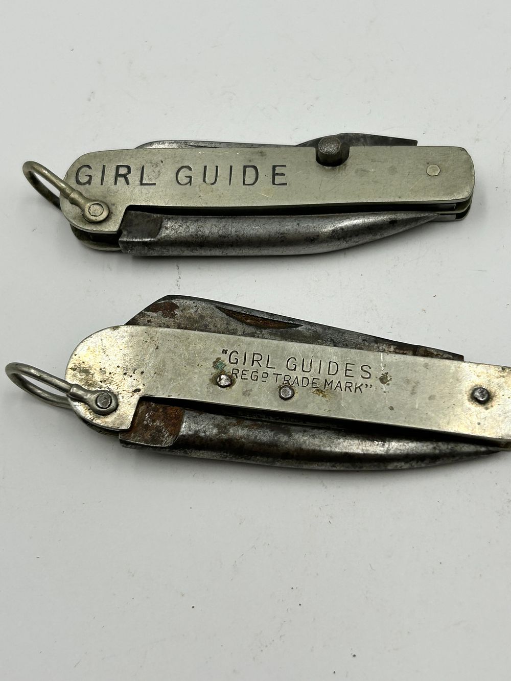 Lot 262: Two Vintage White Metal Girl Guides Multi-Tool Pocket Knives
