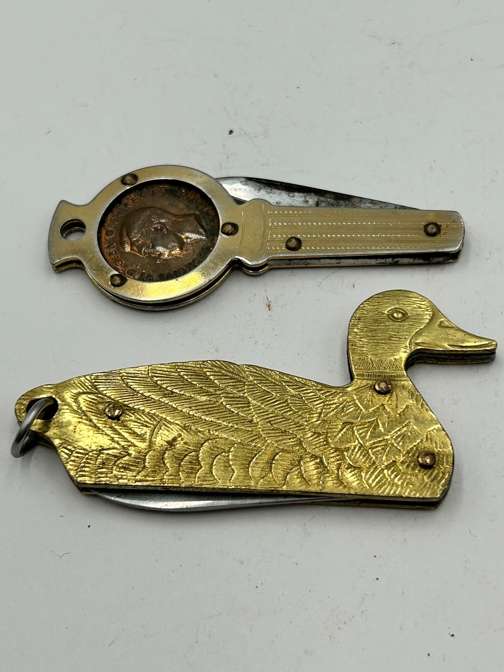 Lot 263: Two George VI British Coin Inset and Mallard Duck Form Pocket Knives