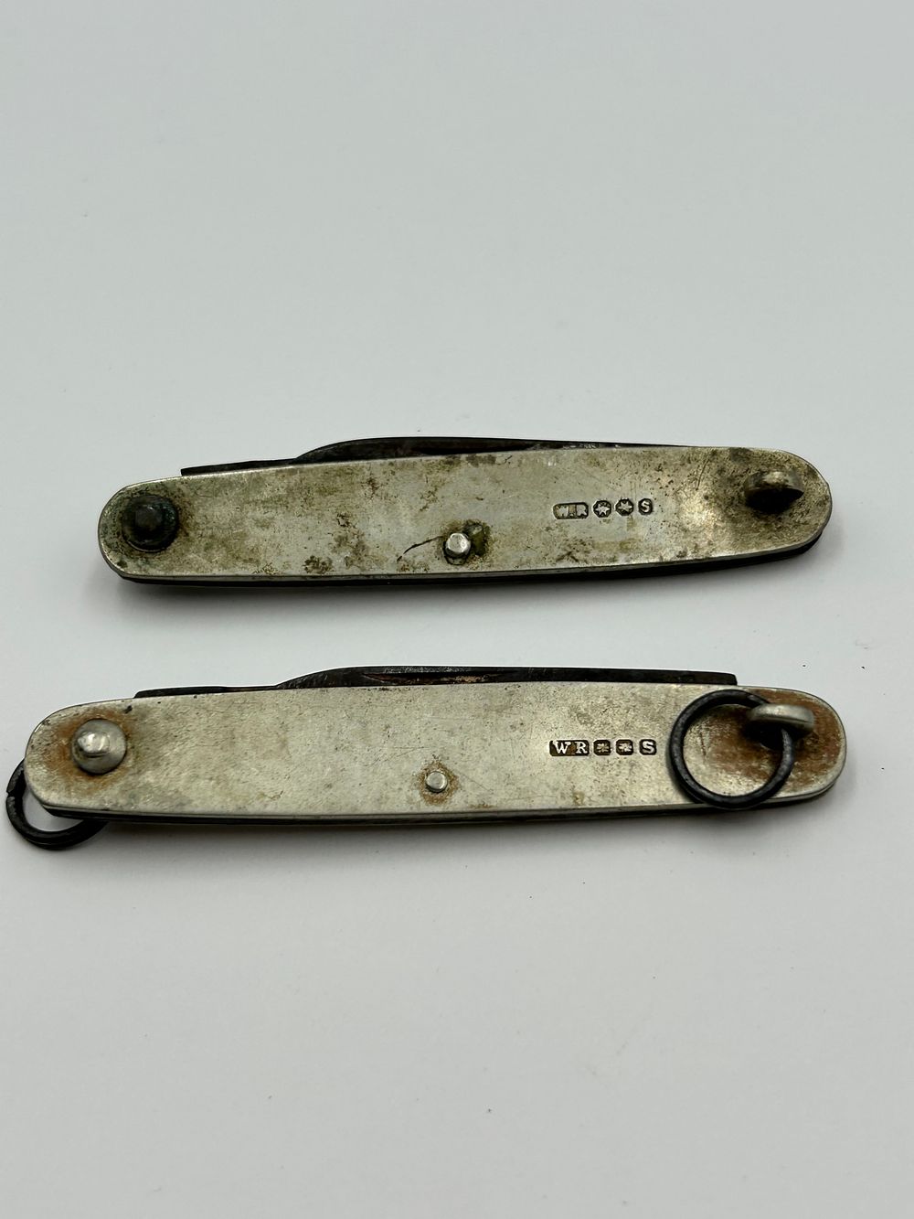 Lot 265: A Pair of W.R. Humphreys & Co.? White Metal Folding Pocket Knives