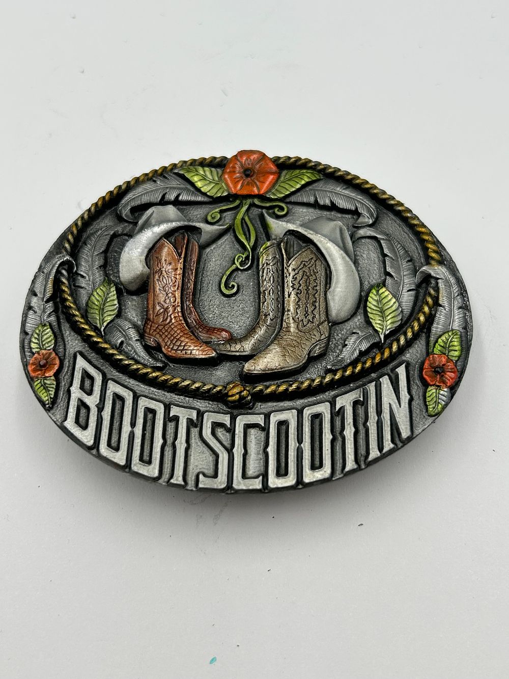 Lot 271: Bergamot White Metal Bootscootin Oval Belt Buckle, 1995