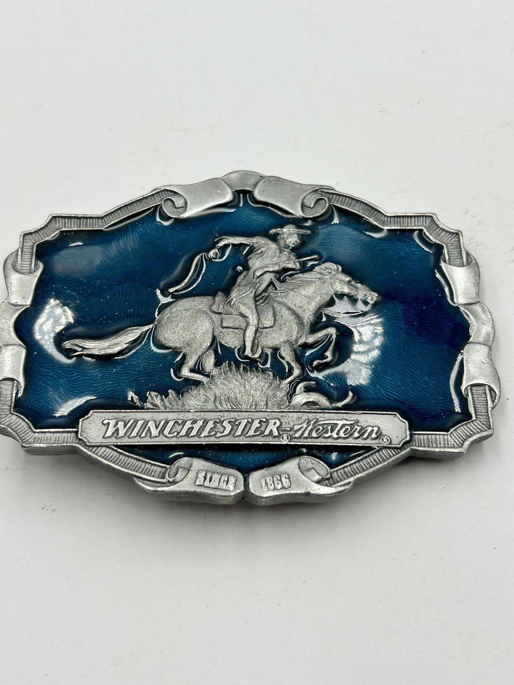 Lot 274: Winchester-Western White Metal and Blue Enamel Commemorative Belt Buckle, Since 1866