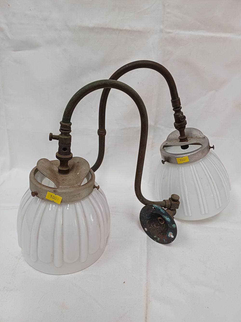 Lot 306: A Pair of Antique Copper Alloy Wall Sconces with Fluted White Glass Shades