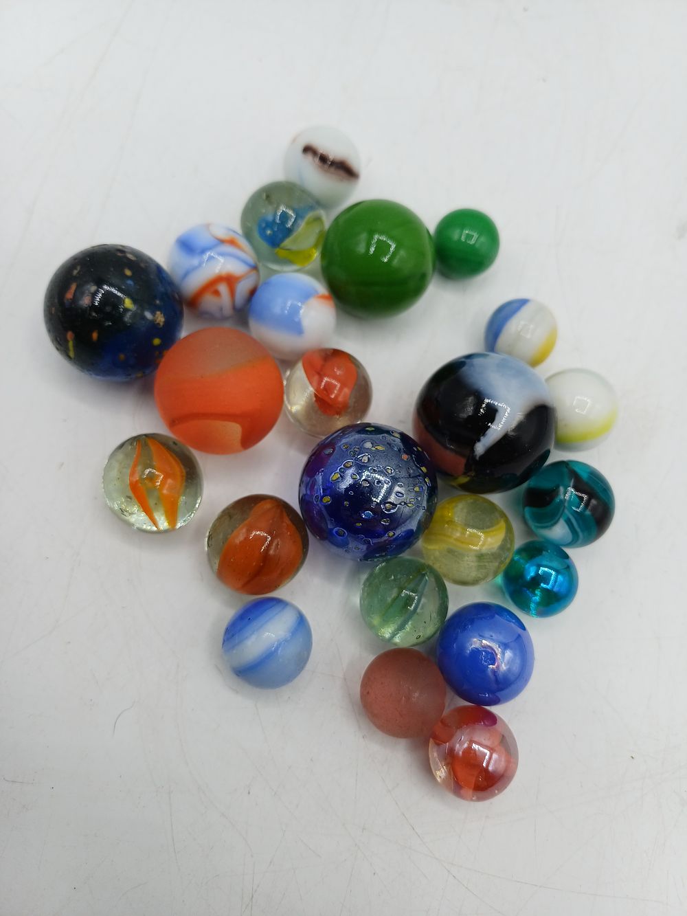Lot 330: An Assortment of Glass Marbles, Including Shooters and Specialty Types