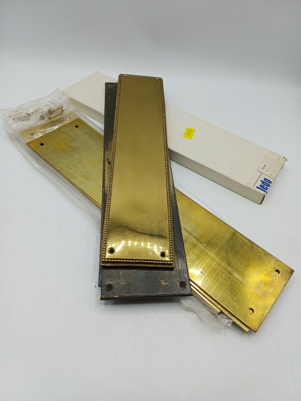 Lot 335: An Assortment of Brass Door Finger Plates by Jedo?