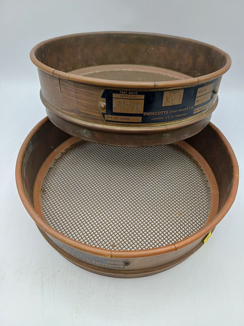 Lot 349: A Pair of Copper Industrial Test Sieves by Endecotts? and Moore?