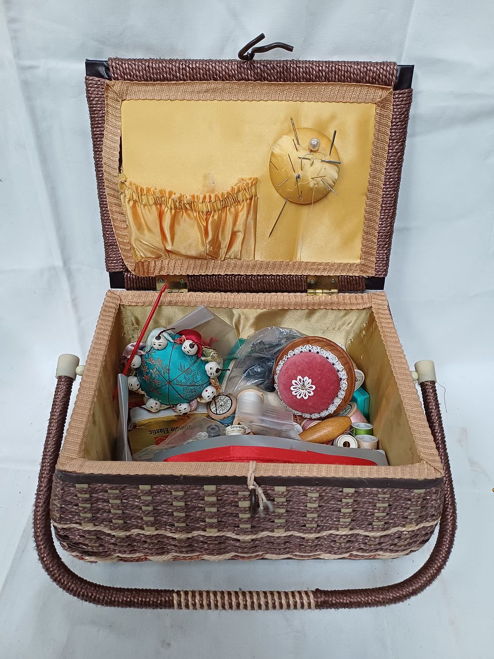 Lot 378: Mid-20th-Century Woven Sewing Basket with Tapestry Lid and Assorted Notions