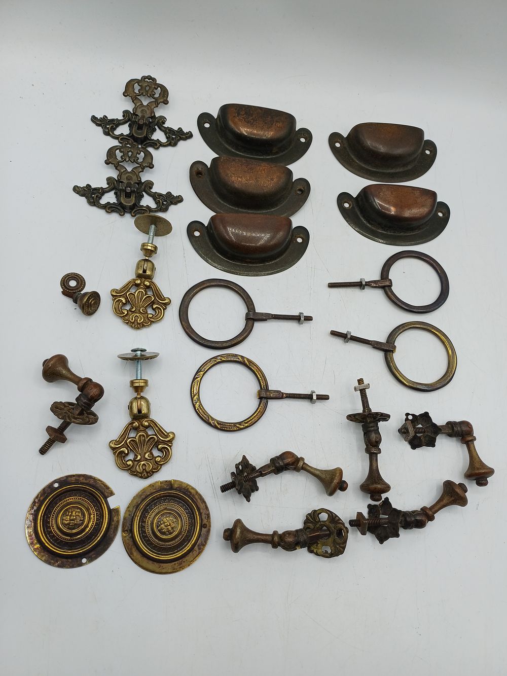 Lot 382: An Assortment of Victorian and Edwardian Style Brass and Copper Toned Furniture Hardware