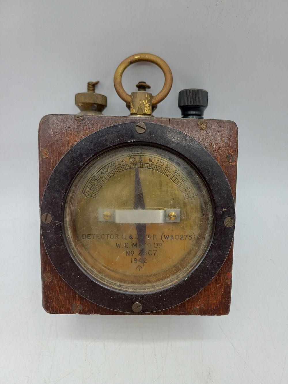 Lot 390: World War II Mahogany and Brass Detector Q & I T.P. by W.E.M. Co. LTD, 1942, 5"