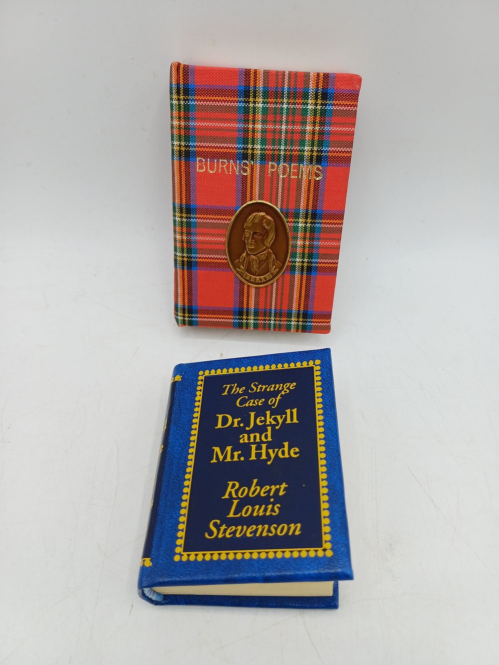 Lot 391: Robert Burns and Robert Louis Stevenson, Two Miniature volumes, Tartan and Faux-Leather