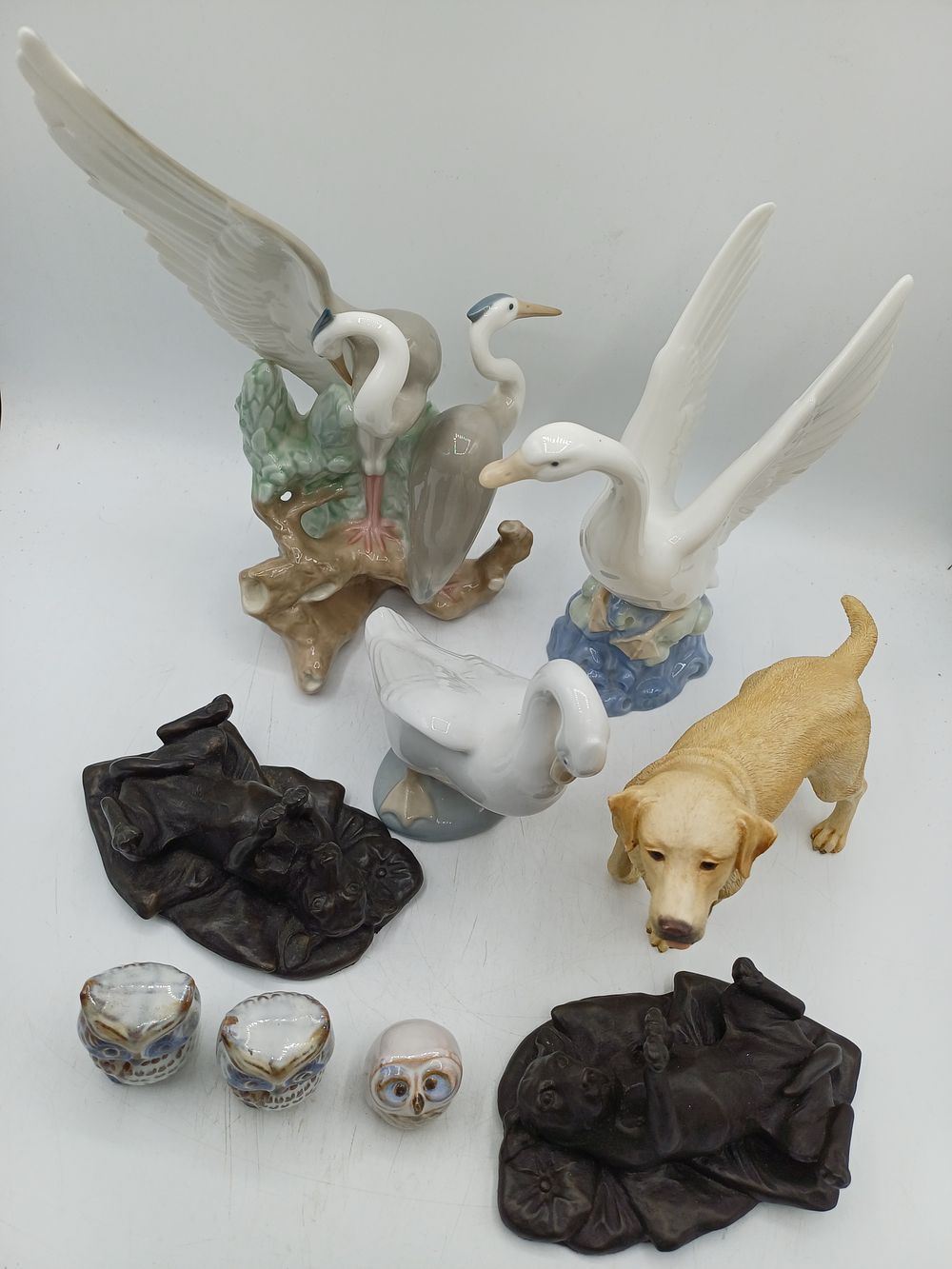 Lot 406: An Assortment of Glazed Porcelain and Resin Animal Figurines