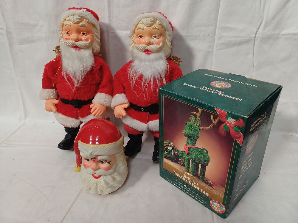 Lot 414: North Pole Productions? Animated Singing Topiary Reindeer and Santa Claus Figures