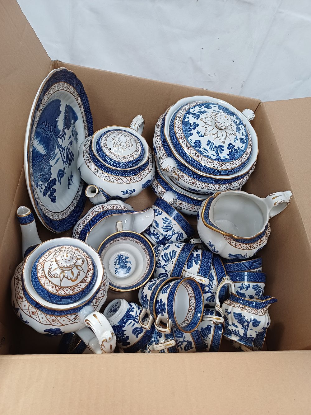 Lot 470: A Collection of Booths? Real Old Willow Pattern Earthenware Table Service Wares