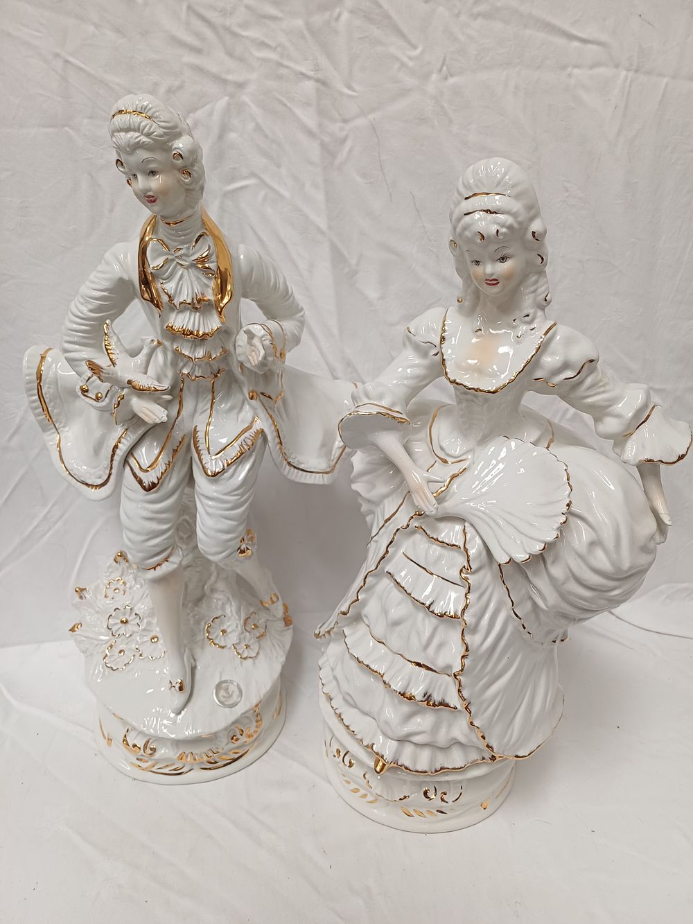Lot 488: A Pair of Capodimonte? Large Gilt Porcelain Figures, 20th Century, 60 cm