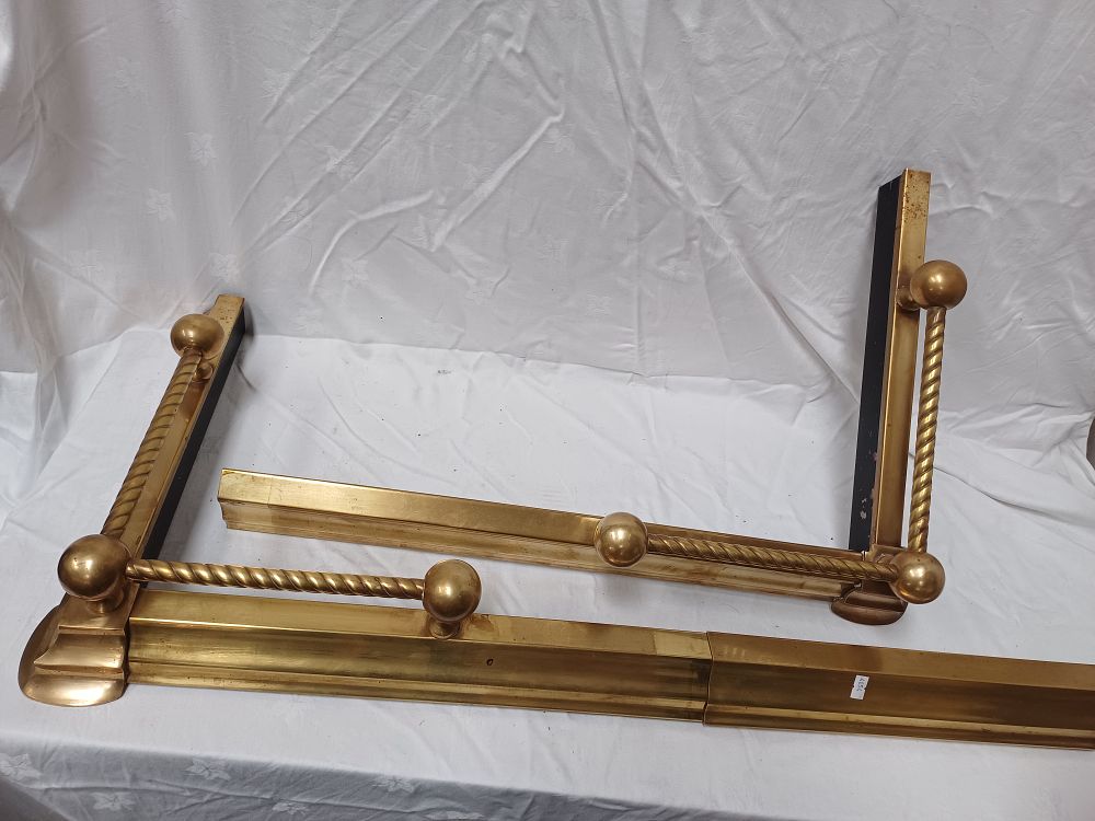 Lot 492: A Pair of Victorian Style Barley Twist Extending Brass Fireplace Fenders