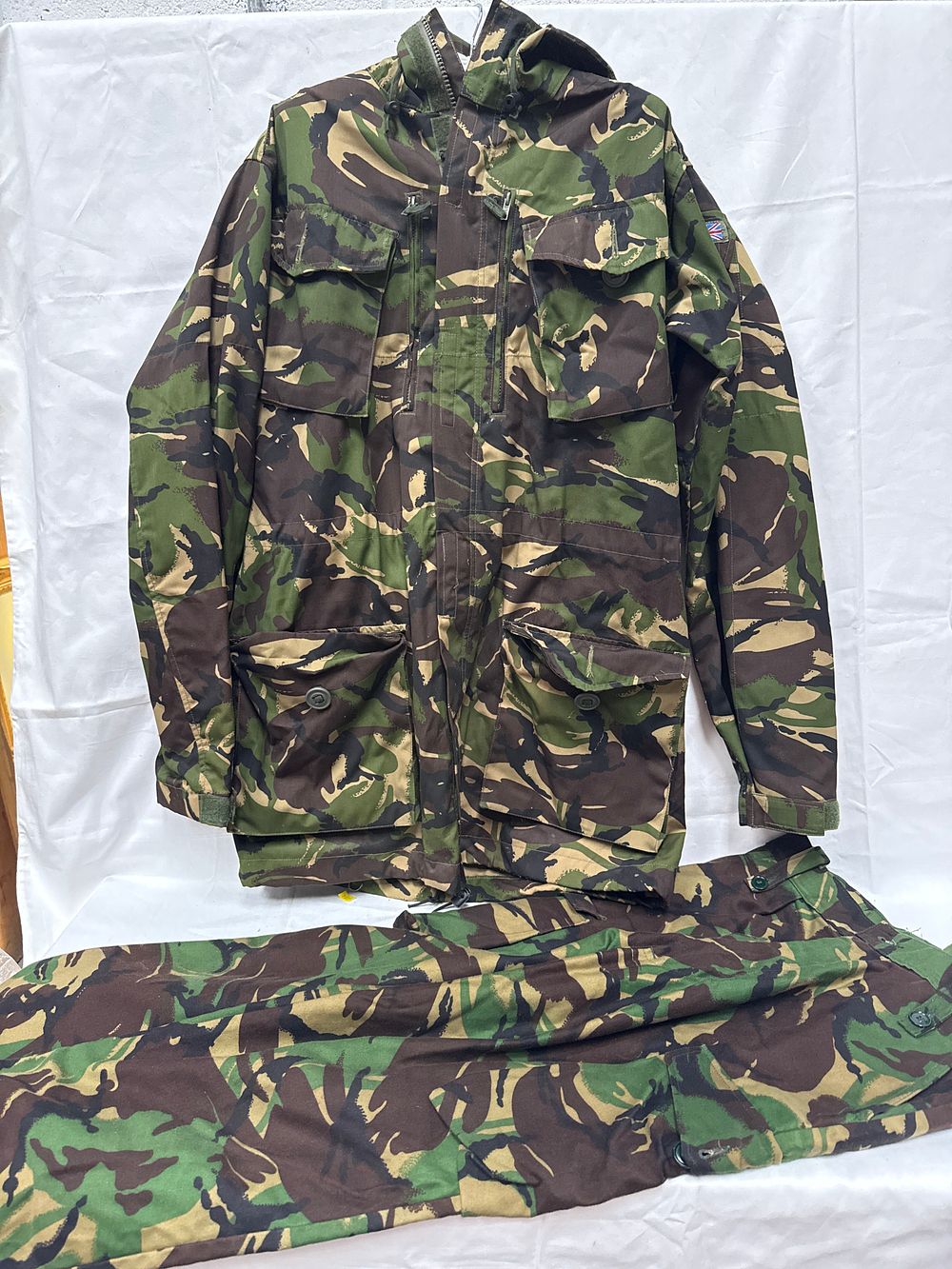Lot 504: British Army DPM Woodland Combat Smock and Trousers by J. Compton Sons & Webb Ltd.