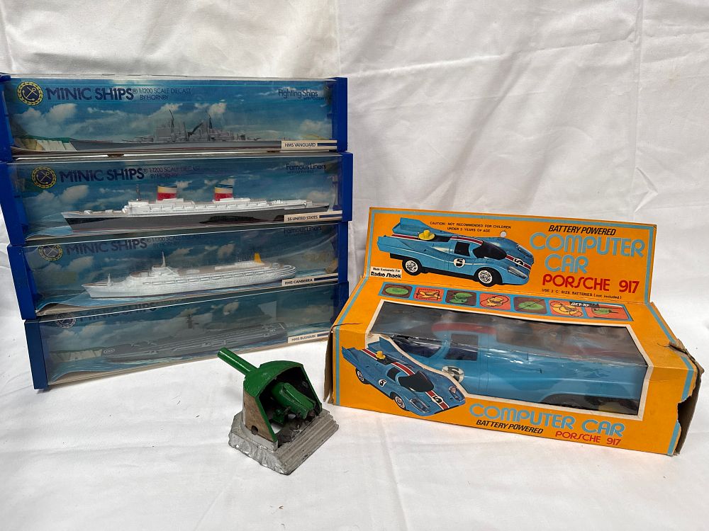 Lot 505: A Collection of Hornby Minic Ships, Radio Shack Porsche 917 and Die-Cast Emplacement