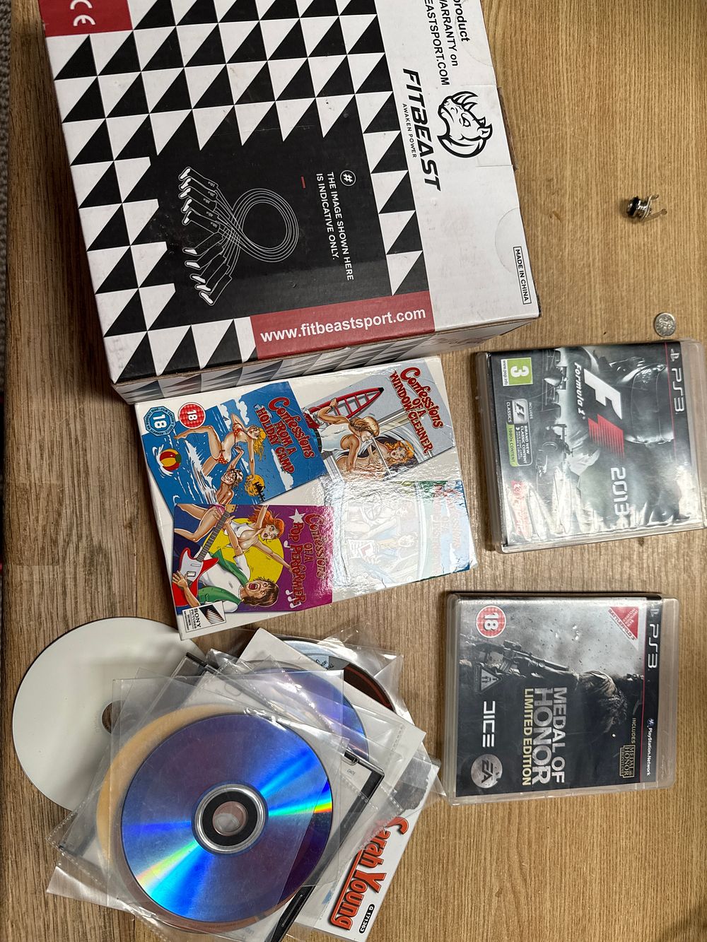 Lot 521: A Collection of Home Media and Fitness Equipment including Adult CDs