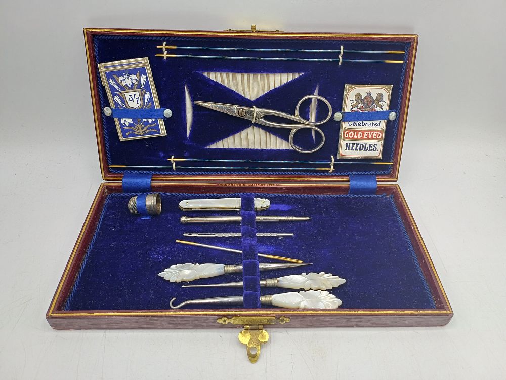 Lot 530: A Victorian? Red Leather Cased Needlework and Vanity Compendium, Sheffield Cutlery