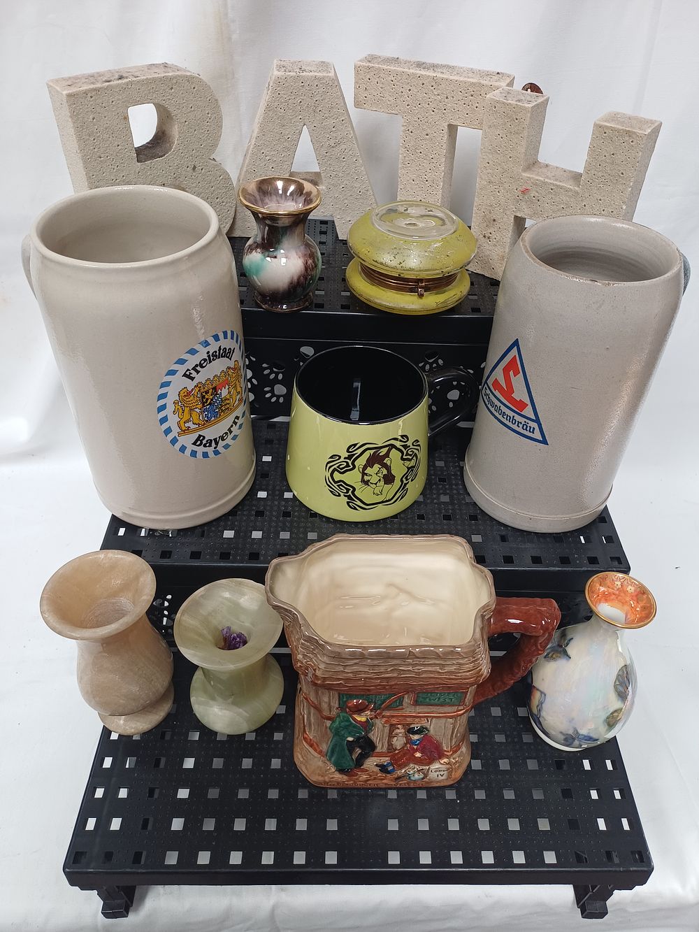 Lot 540: An Assortment of Stoneware Steins, Ceramic Vases, and Cast Stone Letters