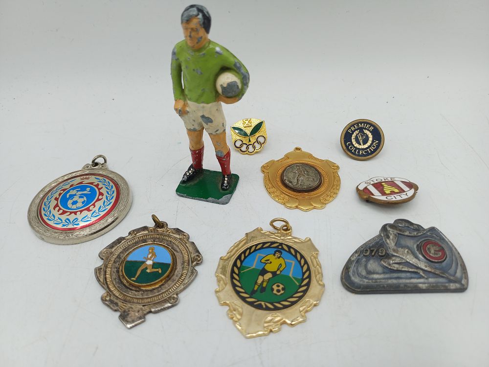 Lot 552: A Collection of Vintage Sports Commemorative Medals, Pins, and Lead Figure