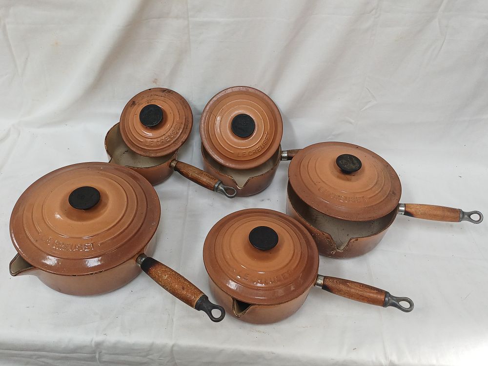 Lot 577: Le Creuset Set of Graduated Enameled Cast Iron Saucepans, Flame