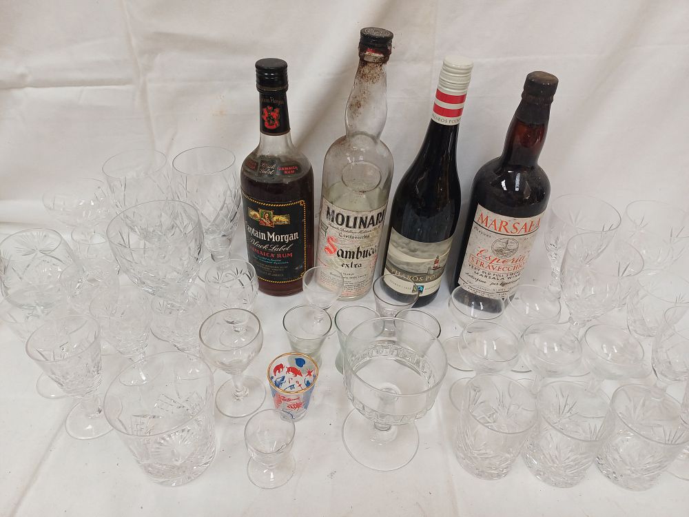 Lot 578: A Collection of Cut Glass Stemware, Tumblers and Bottled Spirits