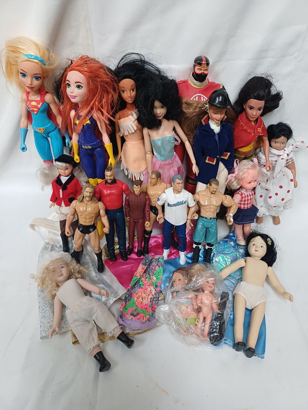 Lot 589: A Collection of DC Super Hero Girls, Disney and Wrestling Action Figures