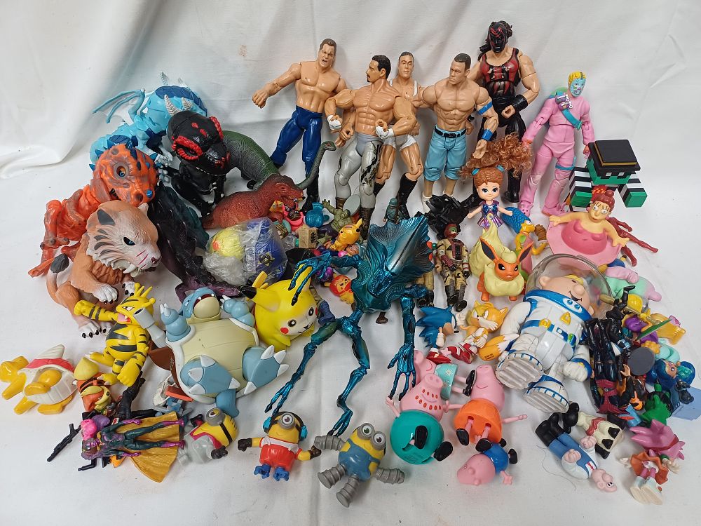 Lot 590: A Collection of Plastic Action Figures and Character Toys